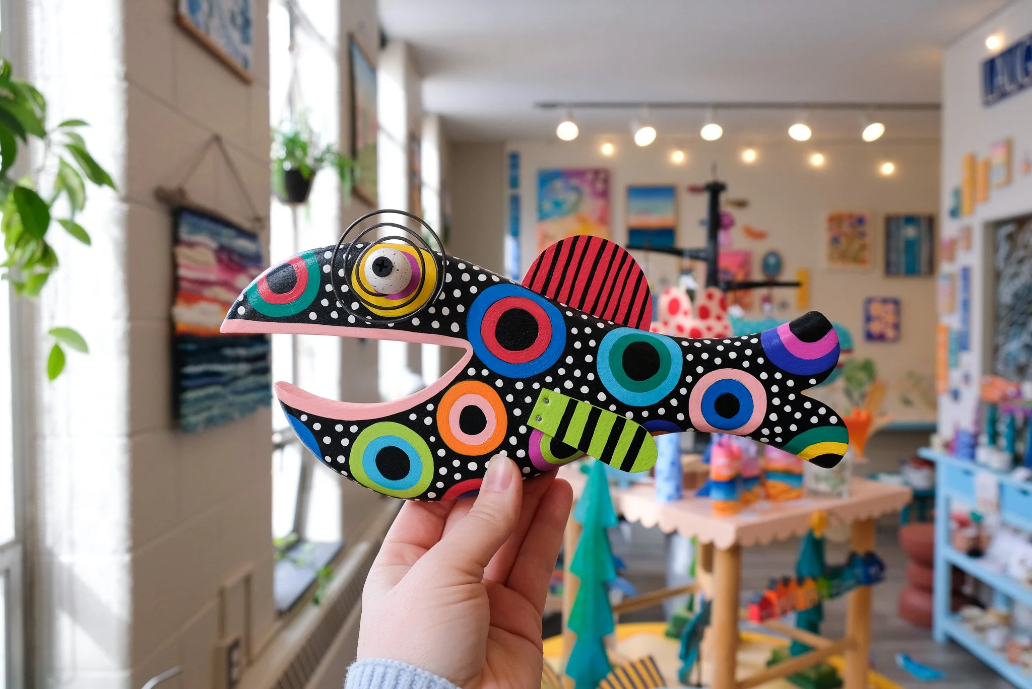 Colorful wooden fish art gallery, paint your own pottery, hands on art traverse city michigan, collectible fish art in Traverse City Michigan, Things to go in Suttons Bay,