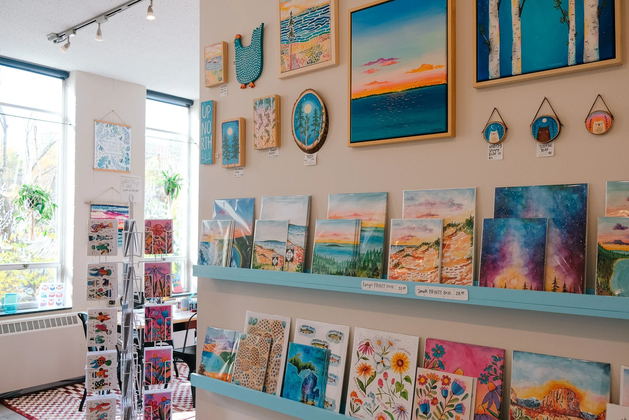 colorful handcrafted fish wall art in Traverse City gallery, local art gallery Traverse City, things to do in Traverse City, Sleeping Bear Dunes Art Gallery, Michigan local artists, unique art in Traverse City, best gift shops in Traverse City