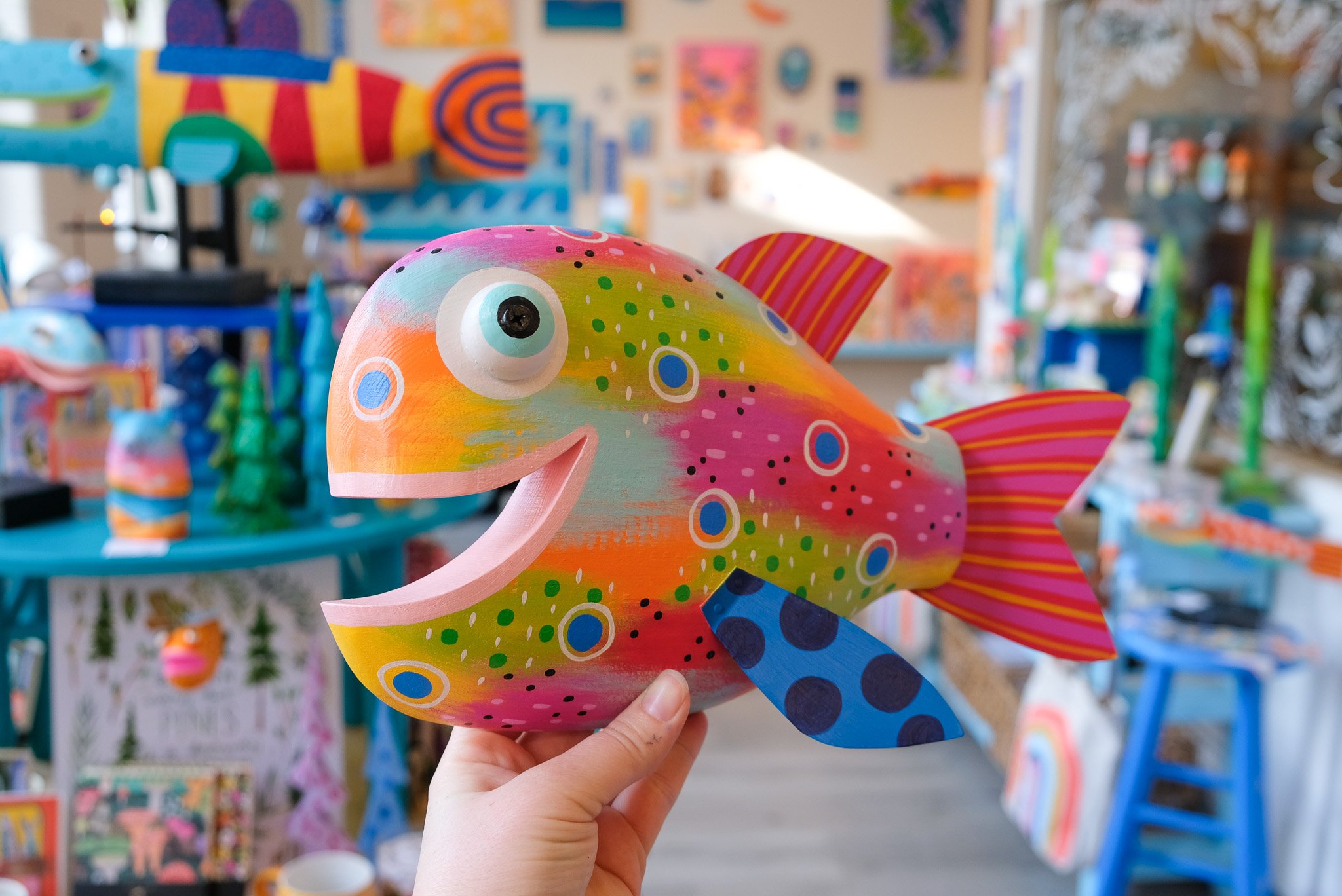 Colorful wood fish art made by Shelly Drews, happy wall art for beach cottage