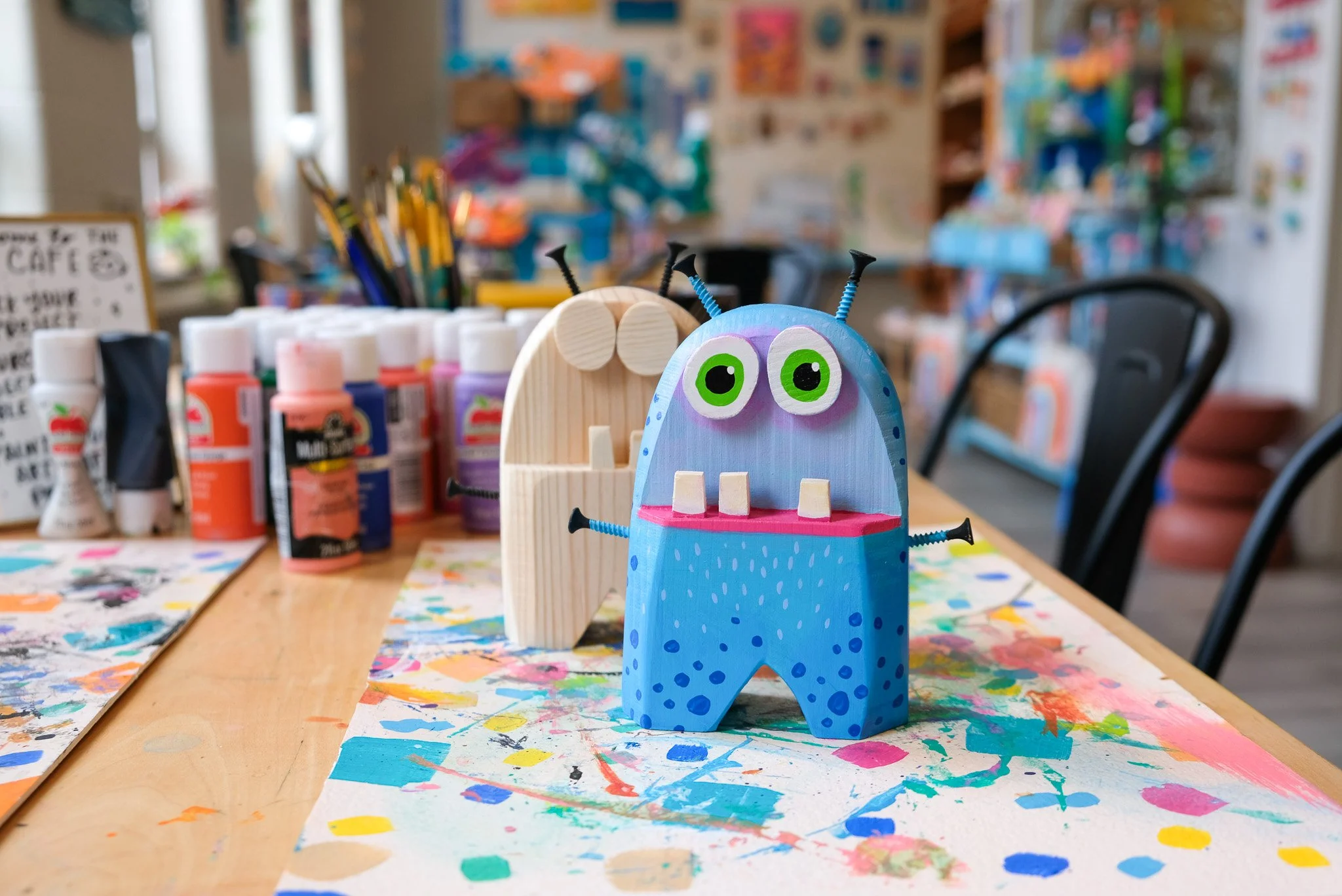 Paint your own wooden monster, art project sin traverse city, creative things to do in traverse city michigan, hands on art projects