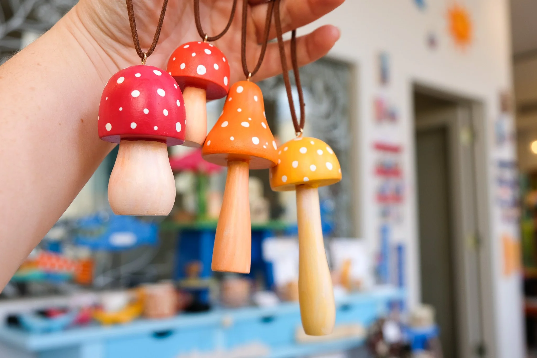 colorful wooden mushroom ornaments, hand painted by Kirstie Drews of Echo Foxx Design in Traverse City Michigan