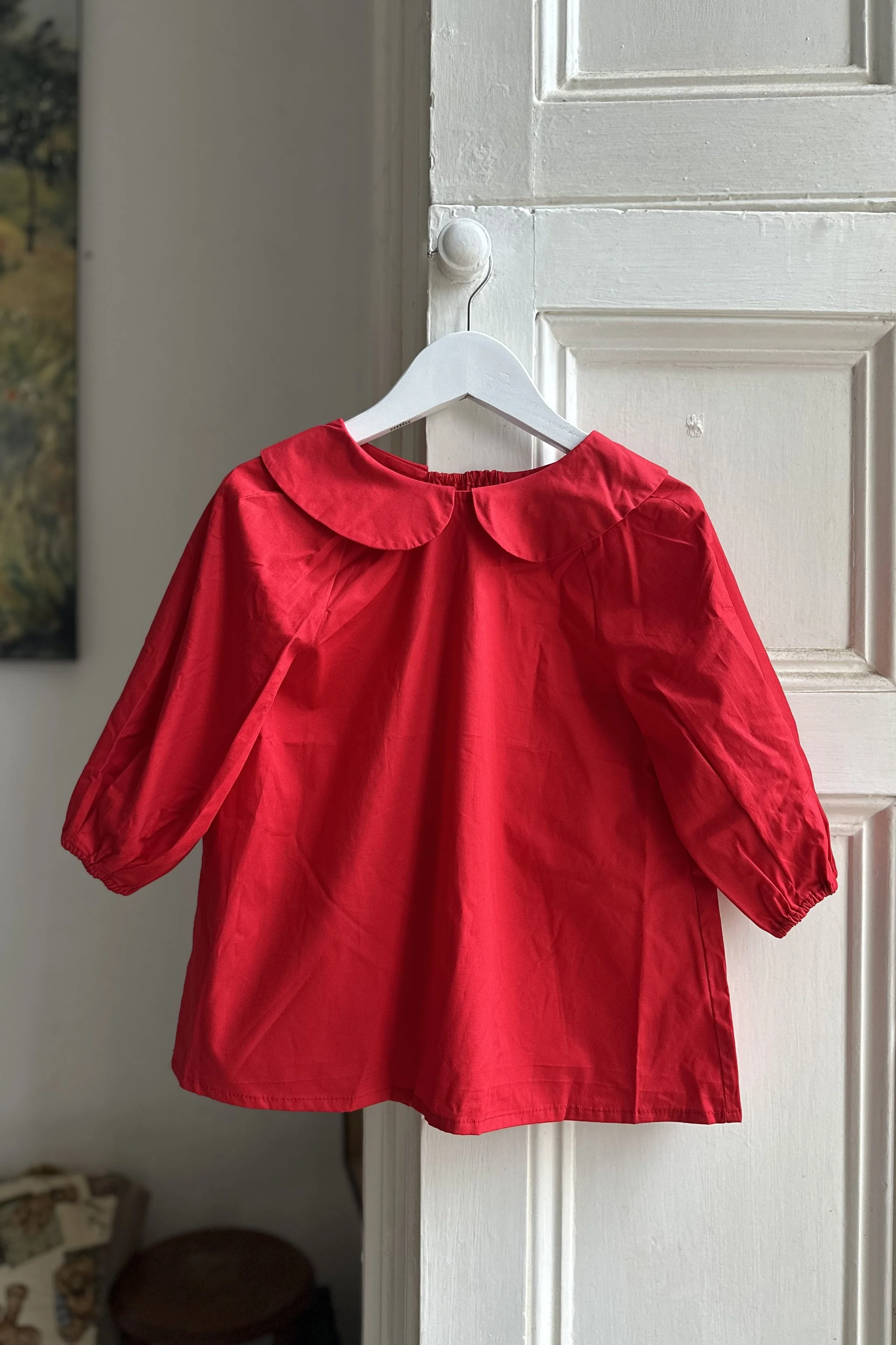 Hanging organic cotton red dress with Peter Pan Collar
