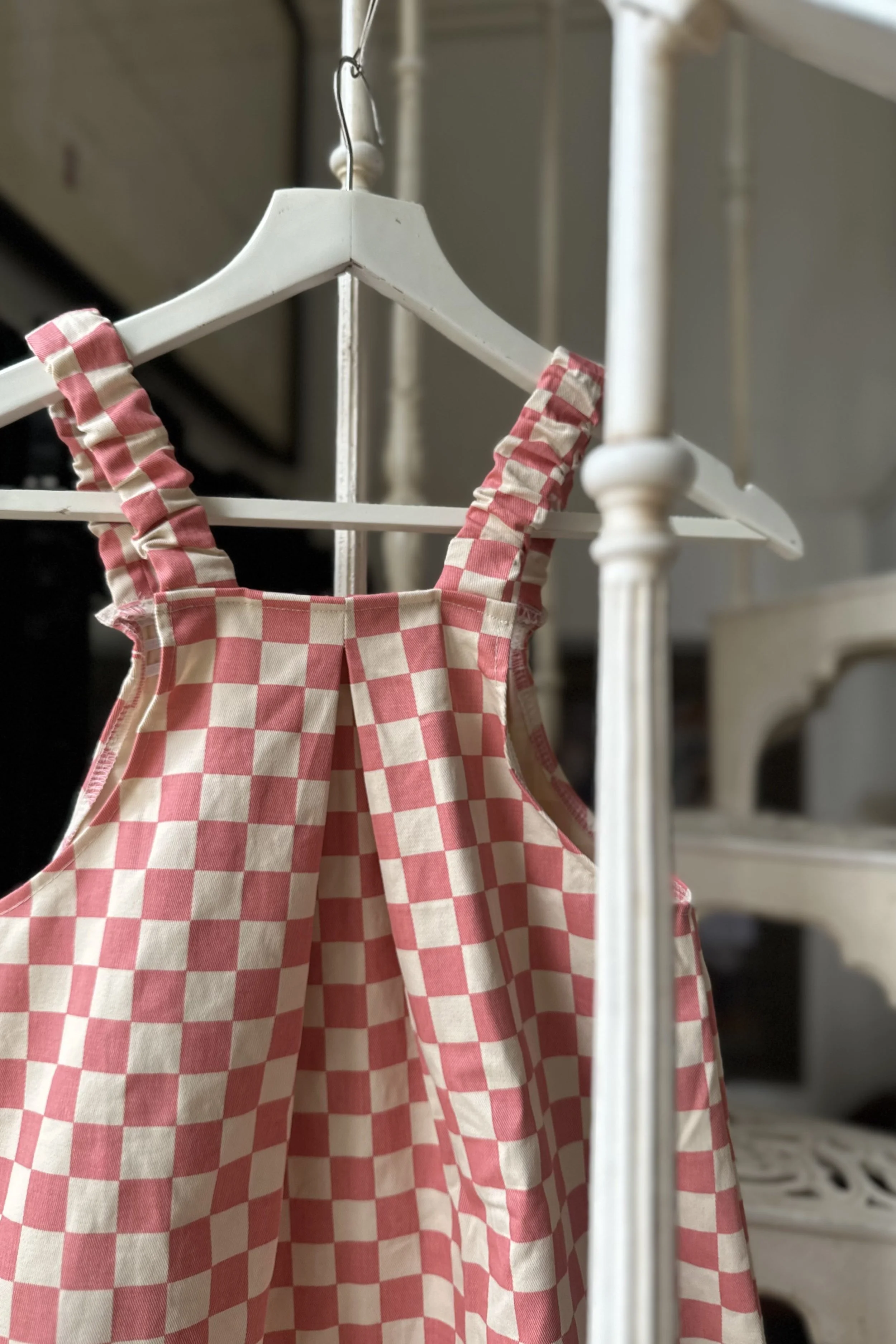 back view of child organic cotton pullover dungarees checkerboard pink