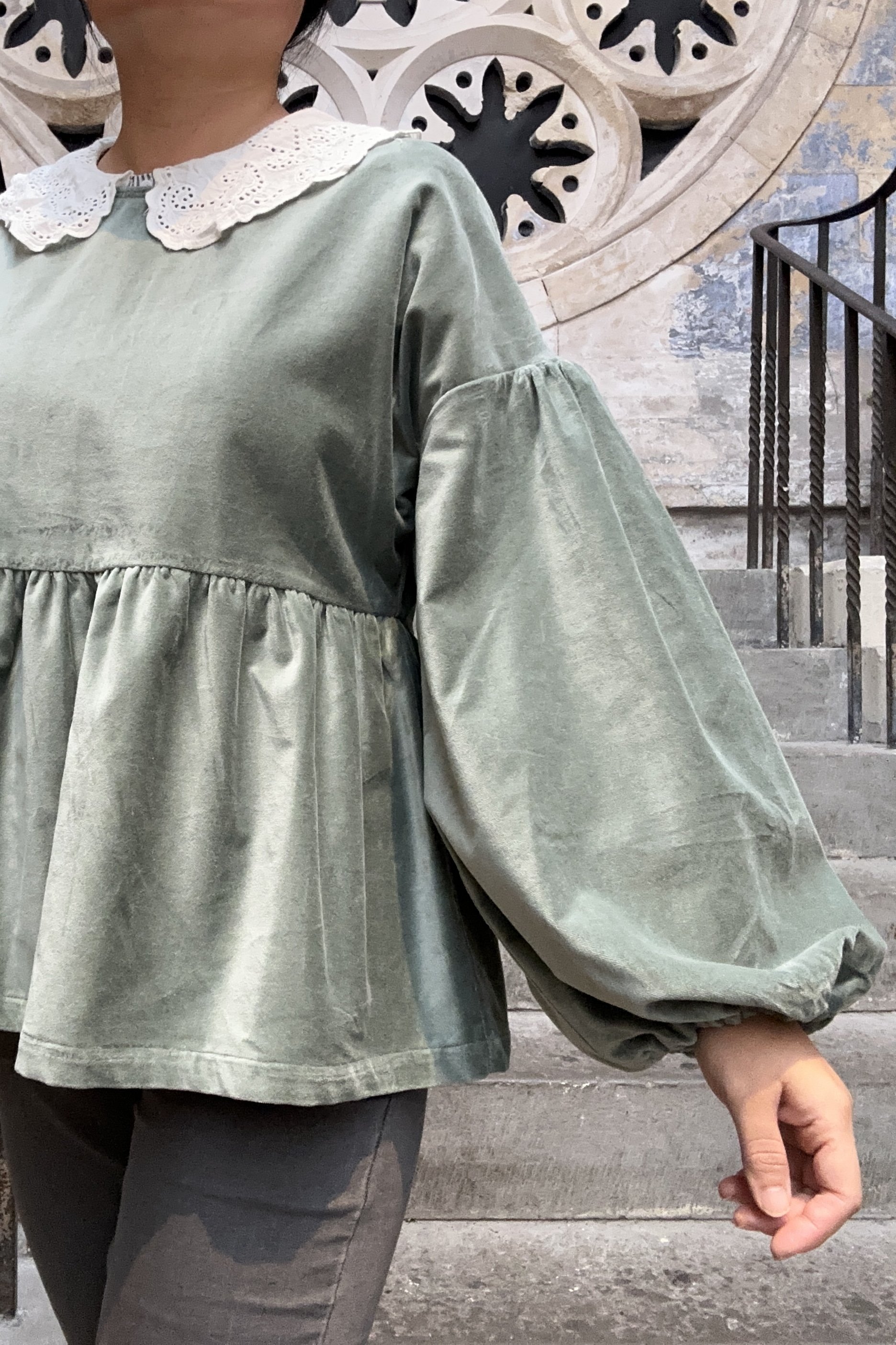 Adult wearing duck egg green-grey velvet Top, Featuring a relaxed fit, balloon sleeves