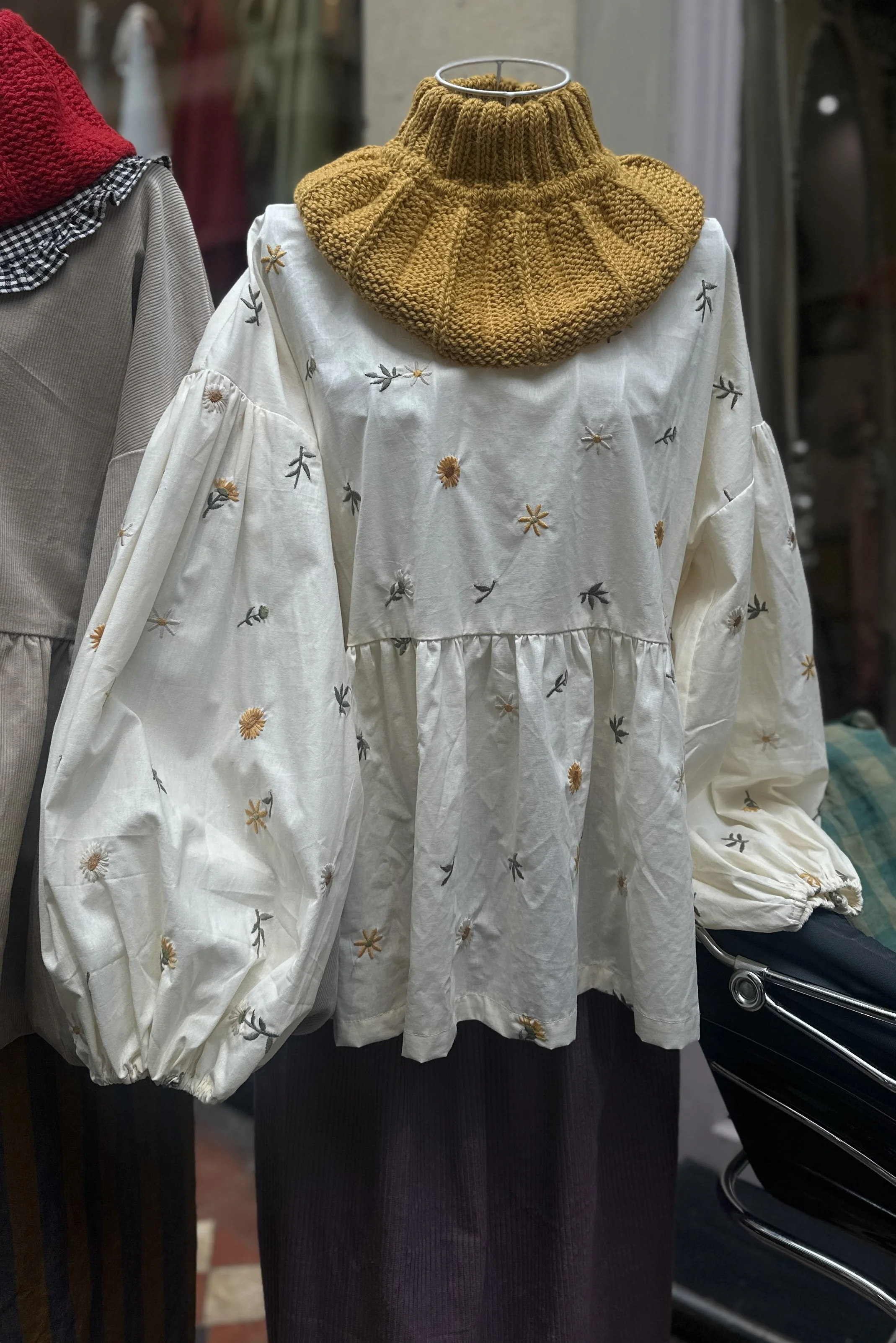 on display embroidered dandelions Top, Featuring a relaxed fit, balloon sleeves, paired with hand-knitted yellow neck warmer