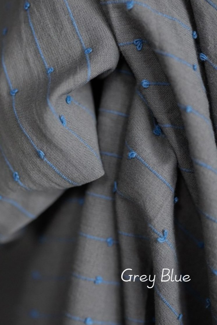 close up light cotton fabric dusty grey-blue with cornflower blue loops