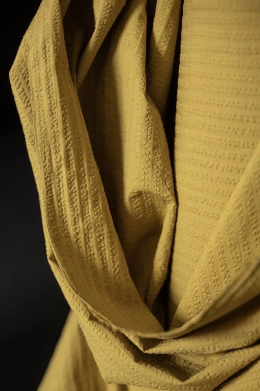 organic cotton seersucker stripe fabric in mustard colour