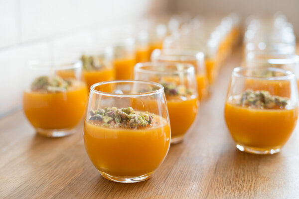  Photo of orange juices in line at event photography London