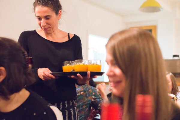 Event photo of woman serving drinks at supper club