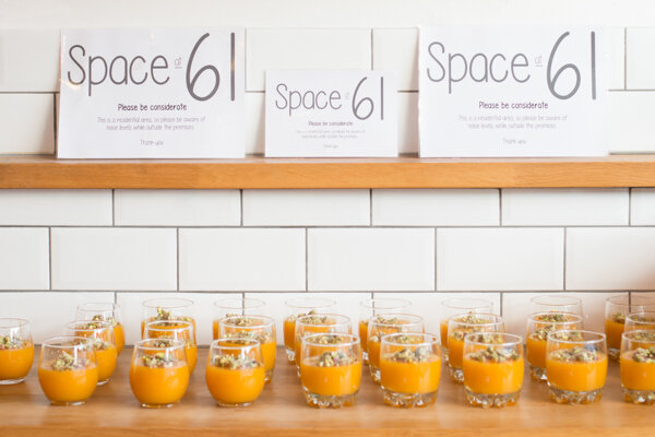 Event photography at Space at 61 - their sign with orange juice underneath