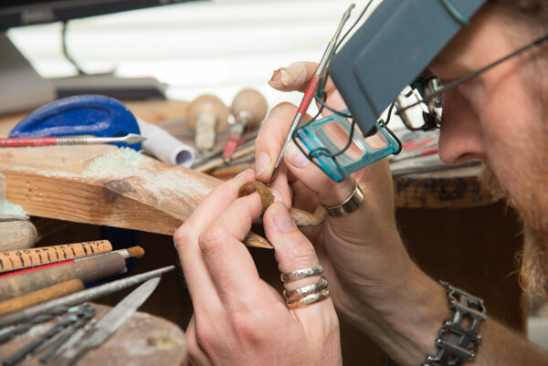 Man making jewellery at brand photography session in Greenwich, London