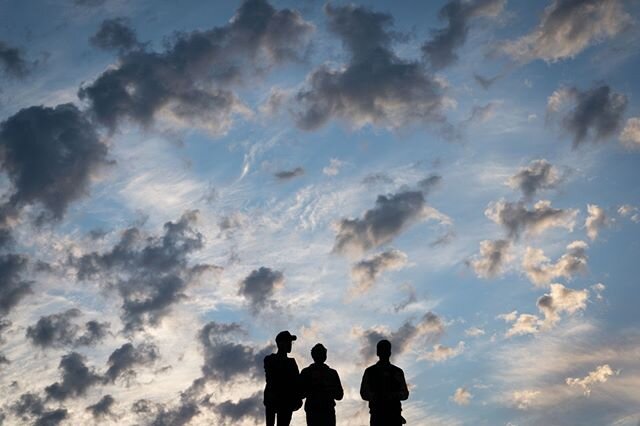 A group of men gather on top of a roof to view a demonstration of more than 5,000 people gathered to honor  the life of George Floyd on Friday, May 29, 2020 in Oakland.⁠
@sbmaneyphoto⁠
This image by Sarahbeth Maney is included in &quot;The Pieces We 