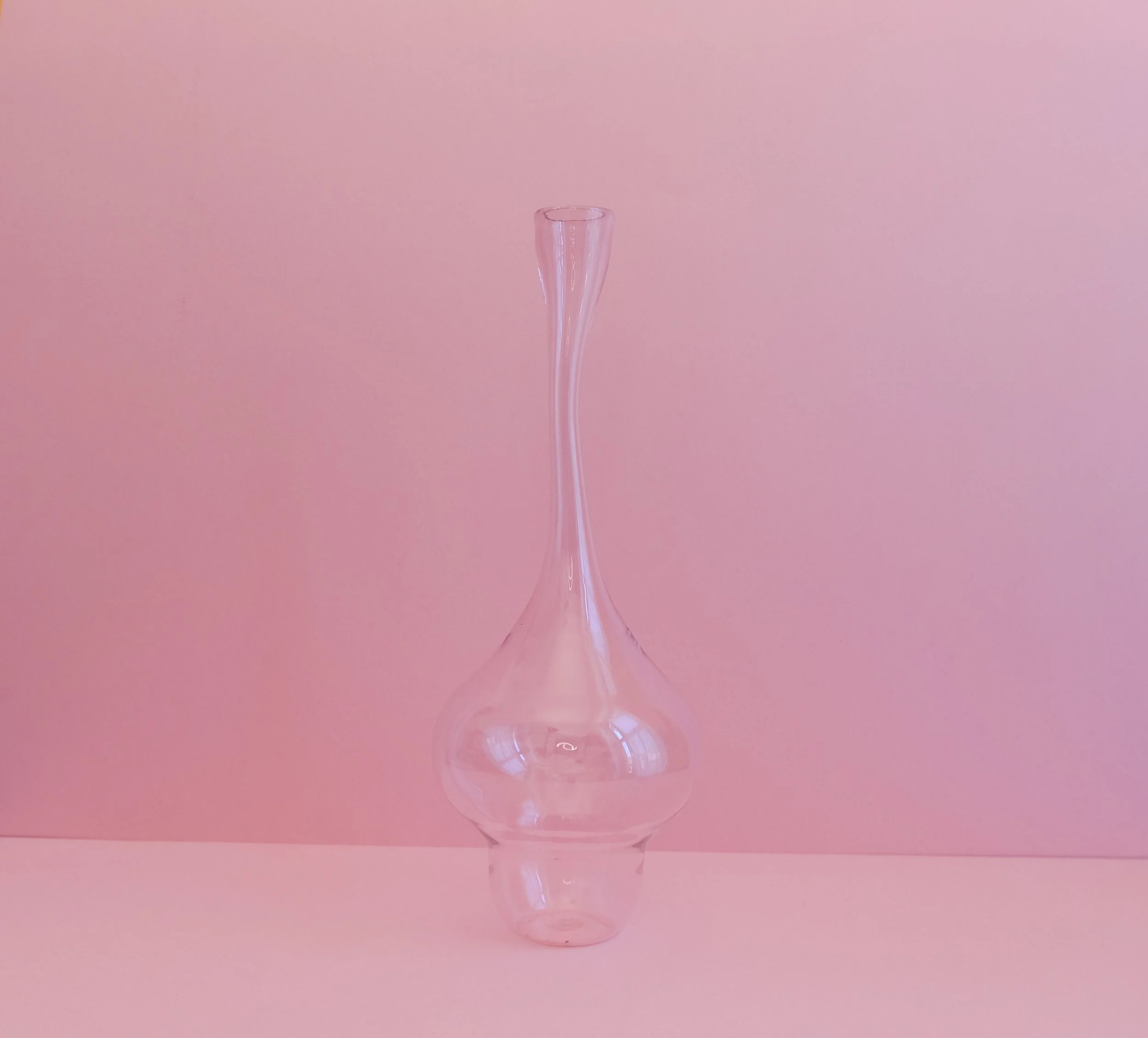 Contemporary hand blown single stem glass vessel. Collectible design made in Palestine.