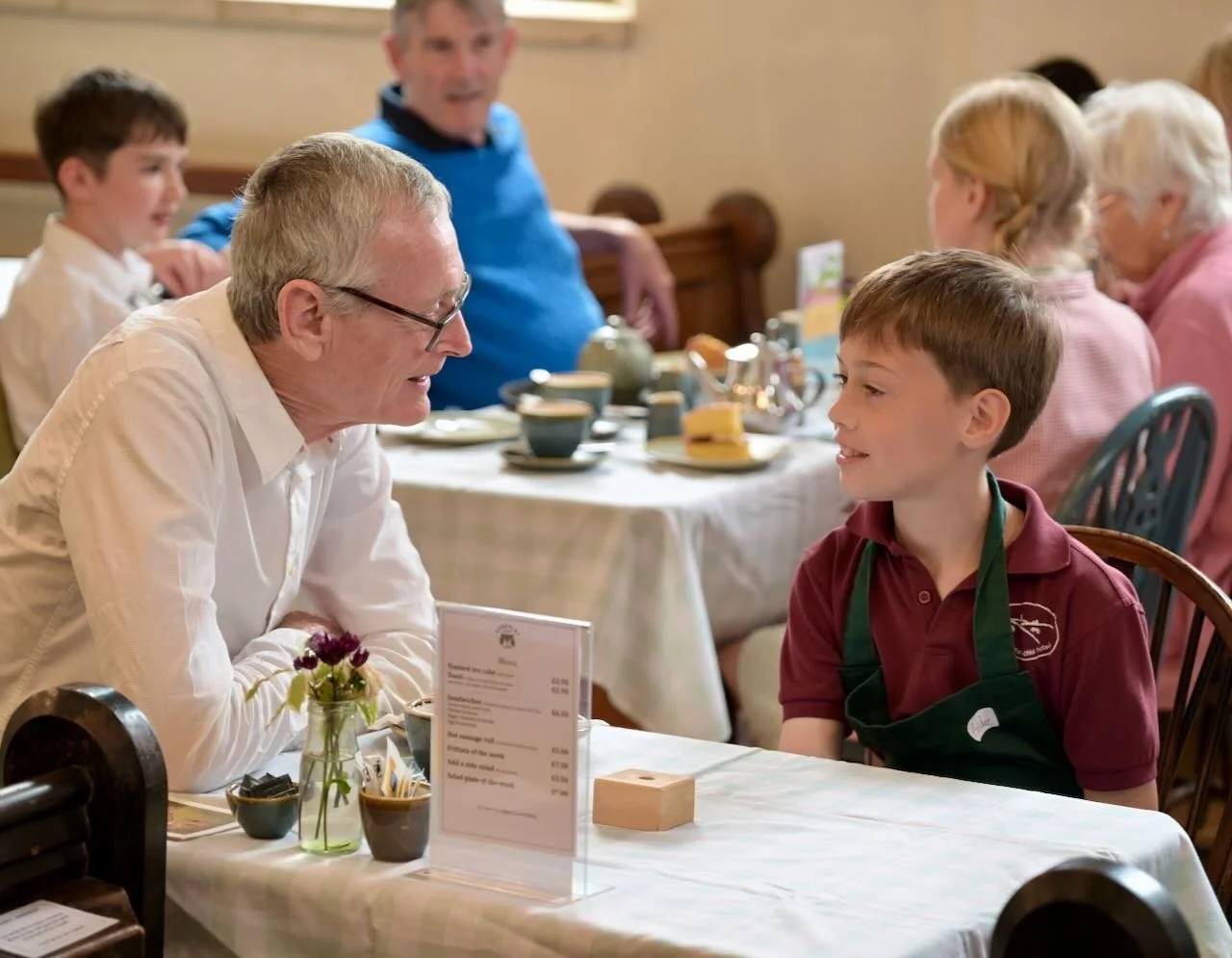 2 generations coming together in the café