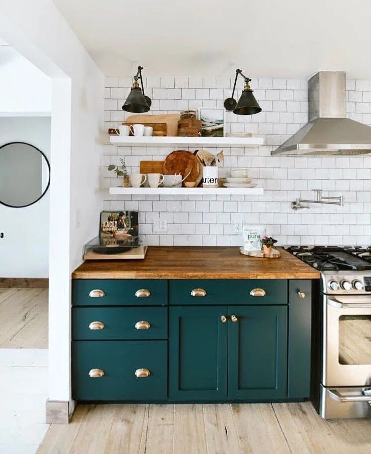 Things I love: Teal cabinets, butcher block countertops, brass drawer pulls
