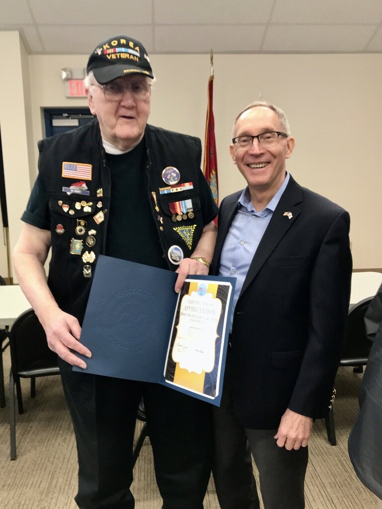  Ed Hewitt, a member of the Richard L. Quatier Chapter of KWVA in Vancouver, with Greg Caldwell, honorary consul. 