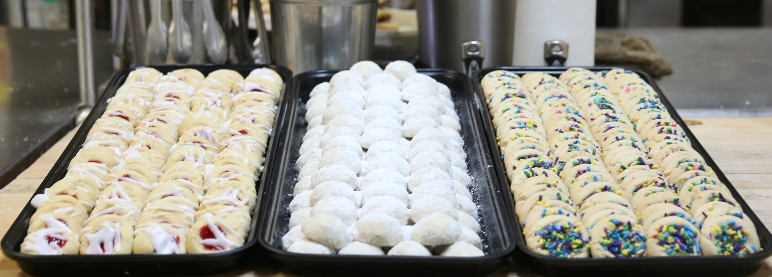 cookies on trays lined up.JPG