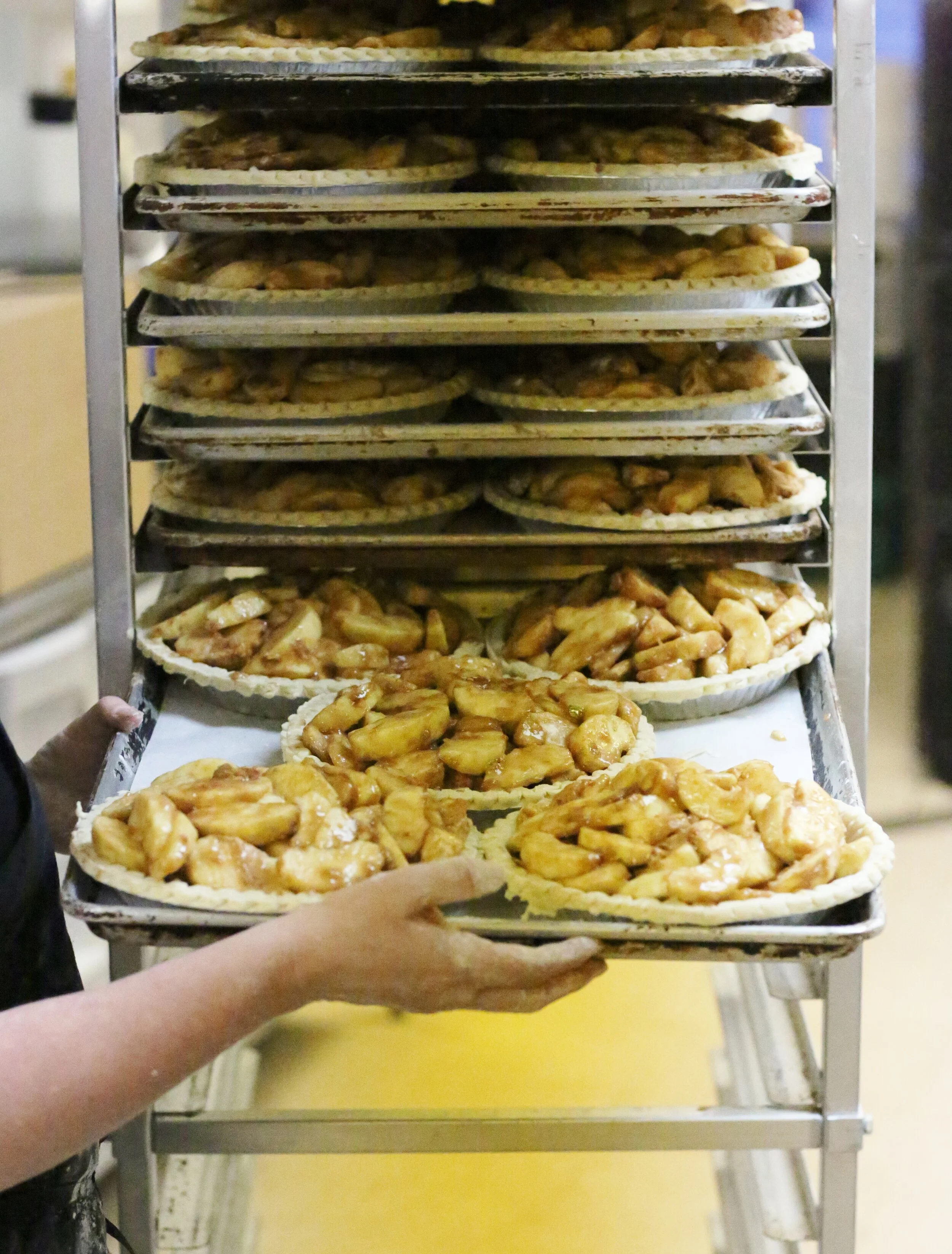 pies on cart with person.JPG