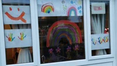 Rainbows are popping up in windows all over the world to spread joy