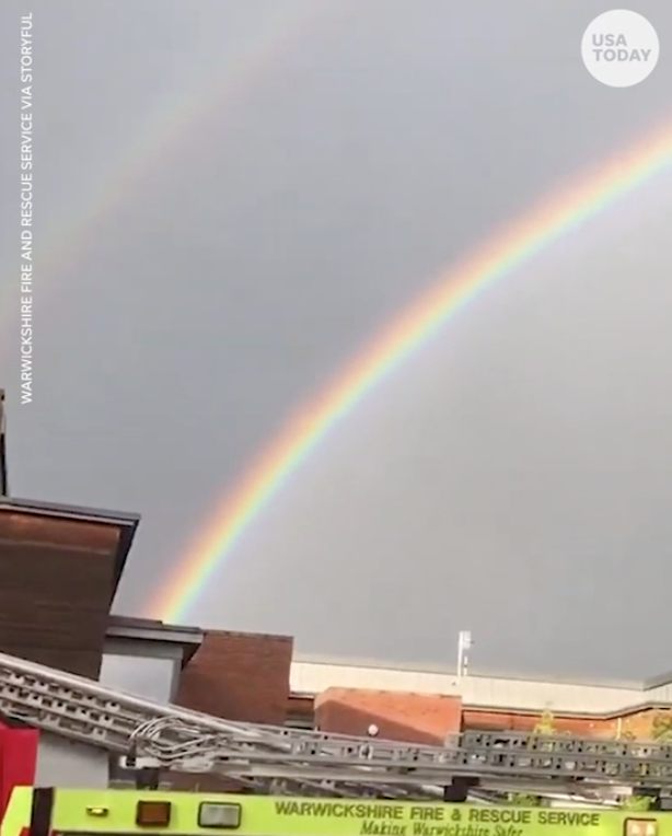 Double rainbow appears behind firefighters cheering for frontline workers