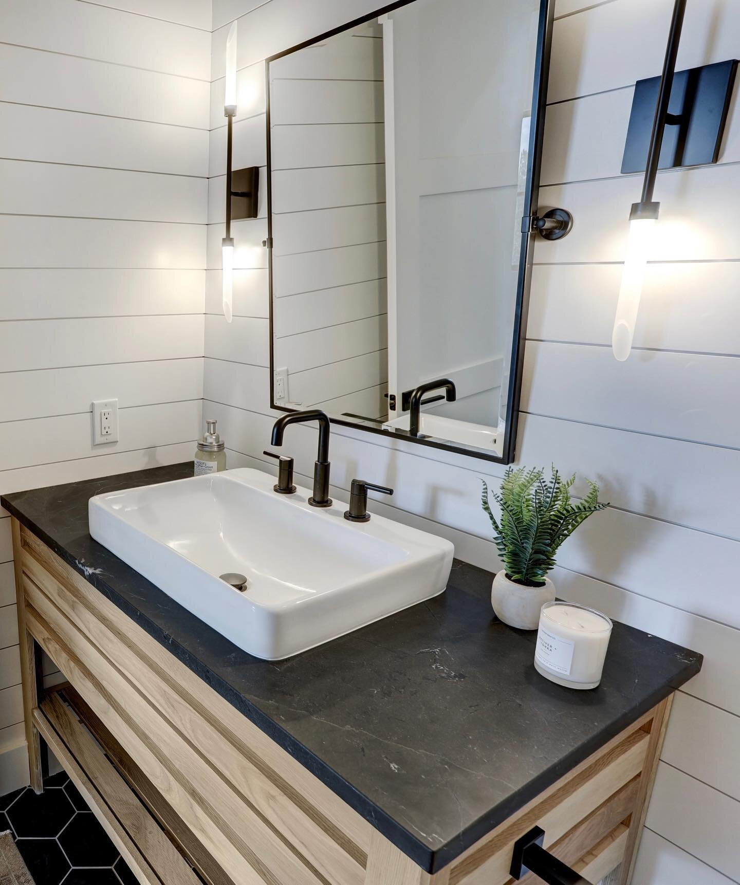 This beautiful powder bathroom doubles as the pool bath at our #clchangelbayhillcountrymodern home.  Our clients loved the powder bath we did in one of our recent projects so selected the same wall sconces, sink and a dark hexagon floor tile but swit
