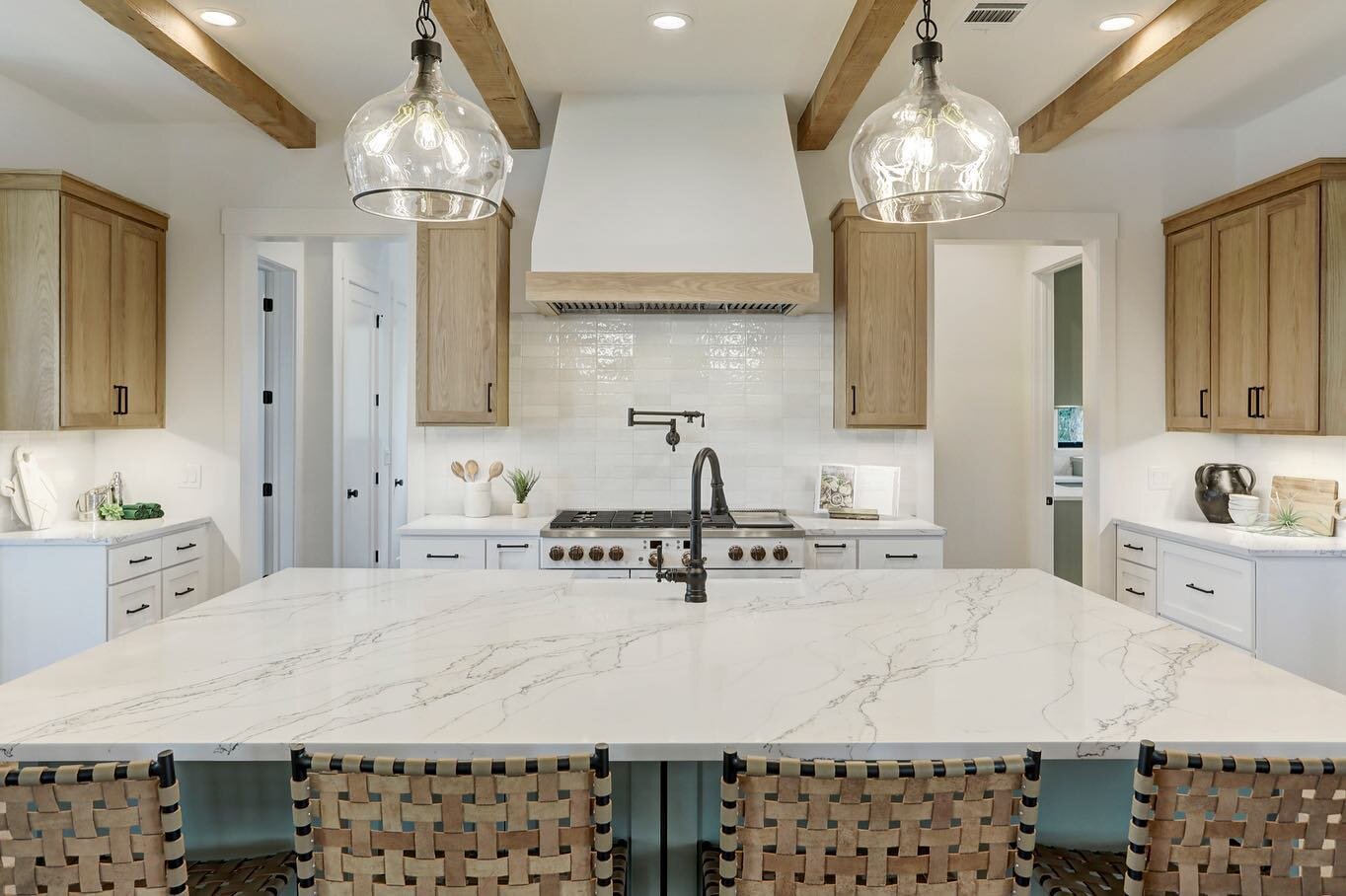 The kitchen is the heart of our home.  It is where our day starts, where we eat, where we gather, and where we entertain guests.  It is my favorite space to design because it sets the tone for the rest of the house.  And we love how this one turned o