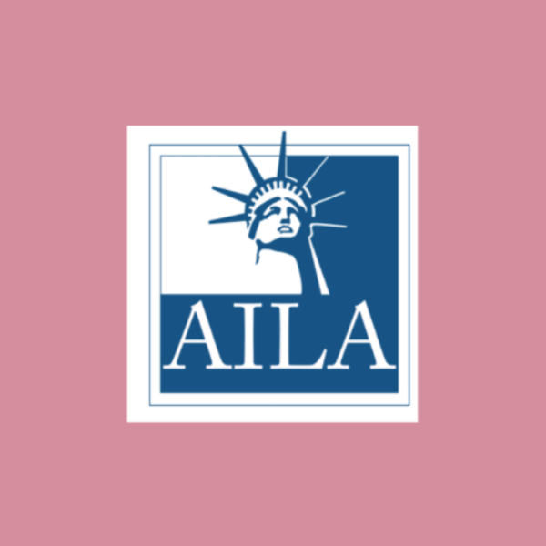 Logo of the American Institute of Landscape Architects (AILA) featuring a stylized depiction of the Statue of Liberty's face with a sunburst behind its head, and the text 'AILA' below.