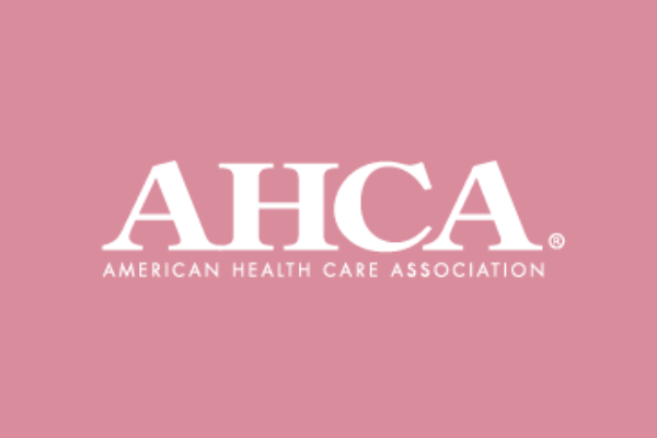 Pink background with the white logo of the American Health Care Association (AHCA) and text 'American Health Care Association' underneath.