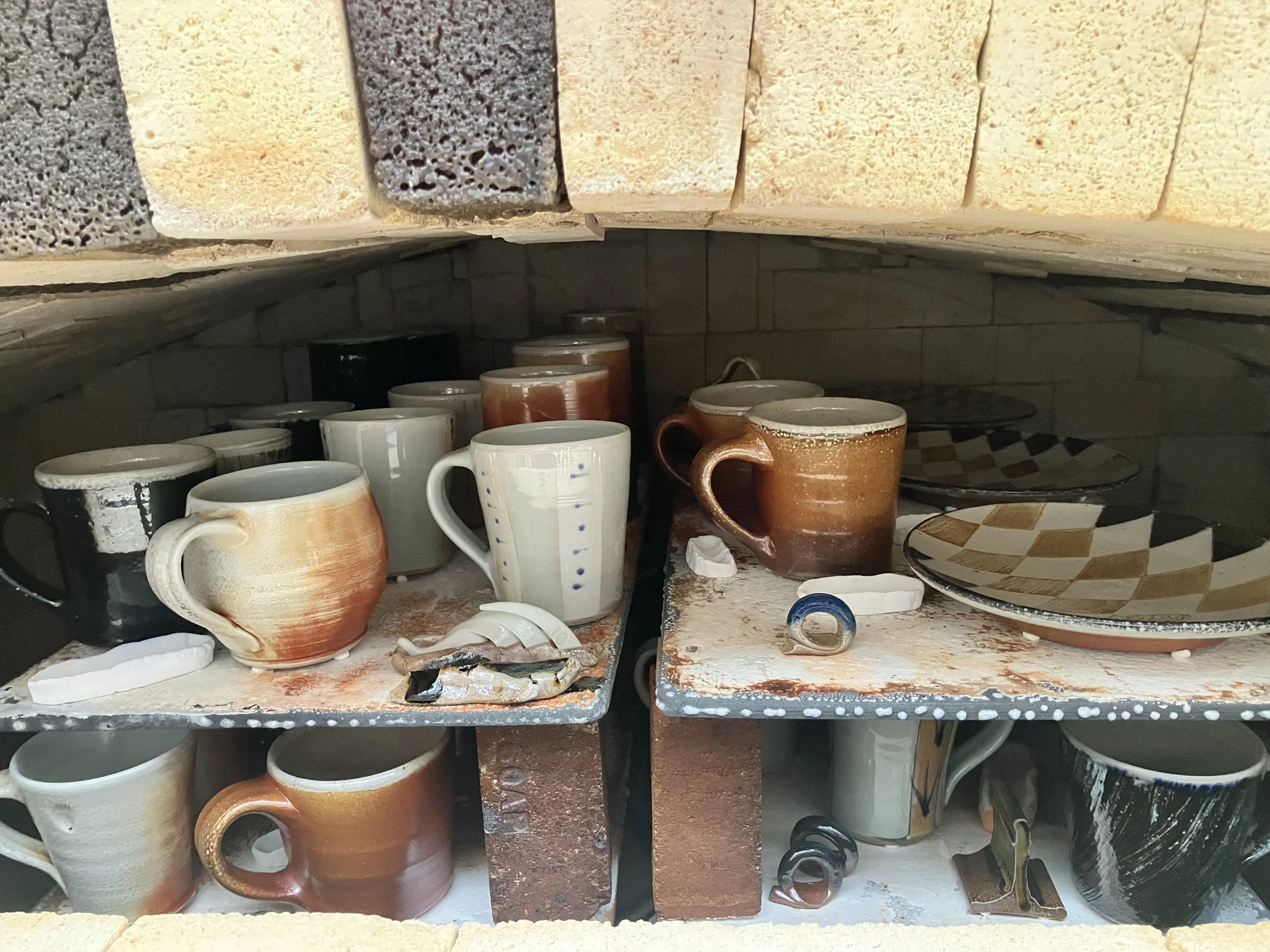 Top two shelves of recent firing