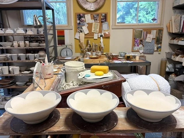 Bowls with cloud design before firing