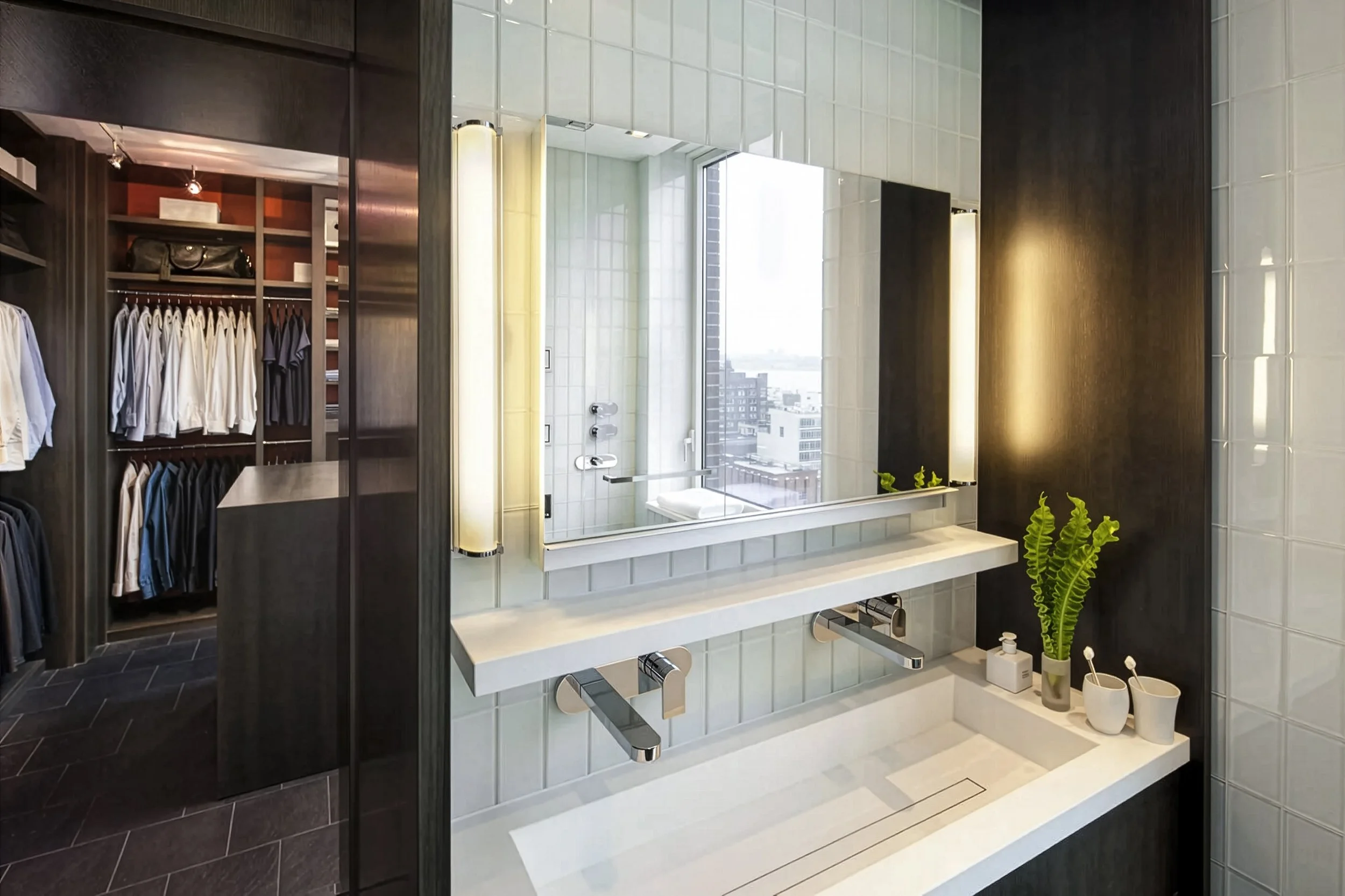 sink with mirror, closet in the background