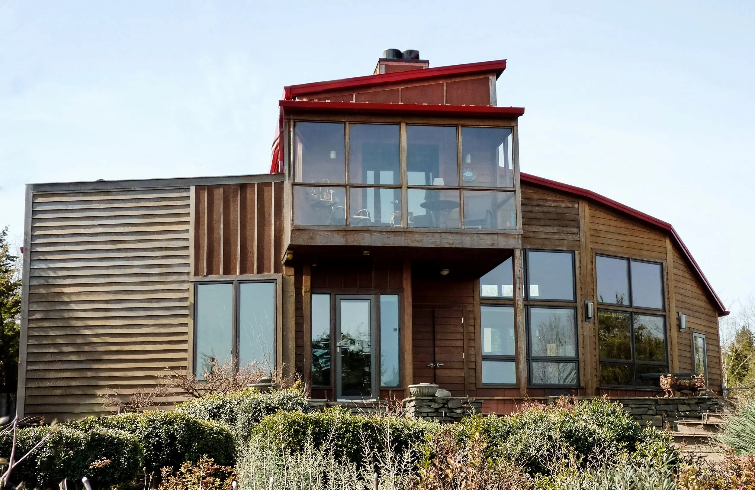 Front view of wood and glass house