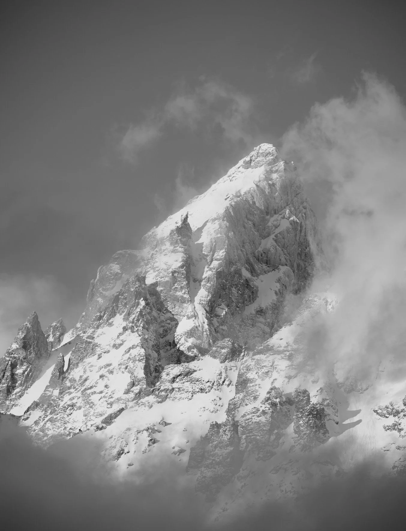 A closer look at the Grand Teton, where the interplay of light, shadow, and swirling clouds created such dramatic textures.  Opted for a black and white conversion here to really emphasize the forms and mood, stripping away color distractions.

Proce