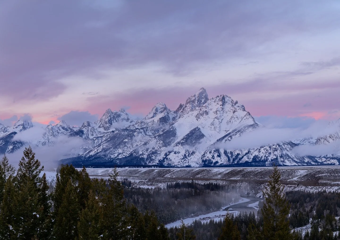 Sunrise at Snake River Overlook. 📸

There is nothing quite like the Teton Range in mid-winter.  While this is one of the most iconic vistas in Wyoming, seeing it blanketed in fresh snow with that first light hitting the clouds feels like seeing it f