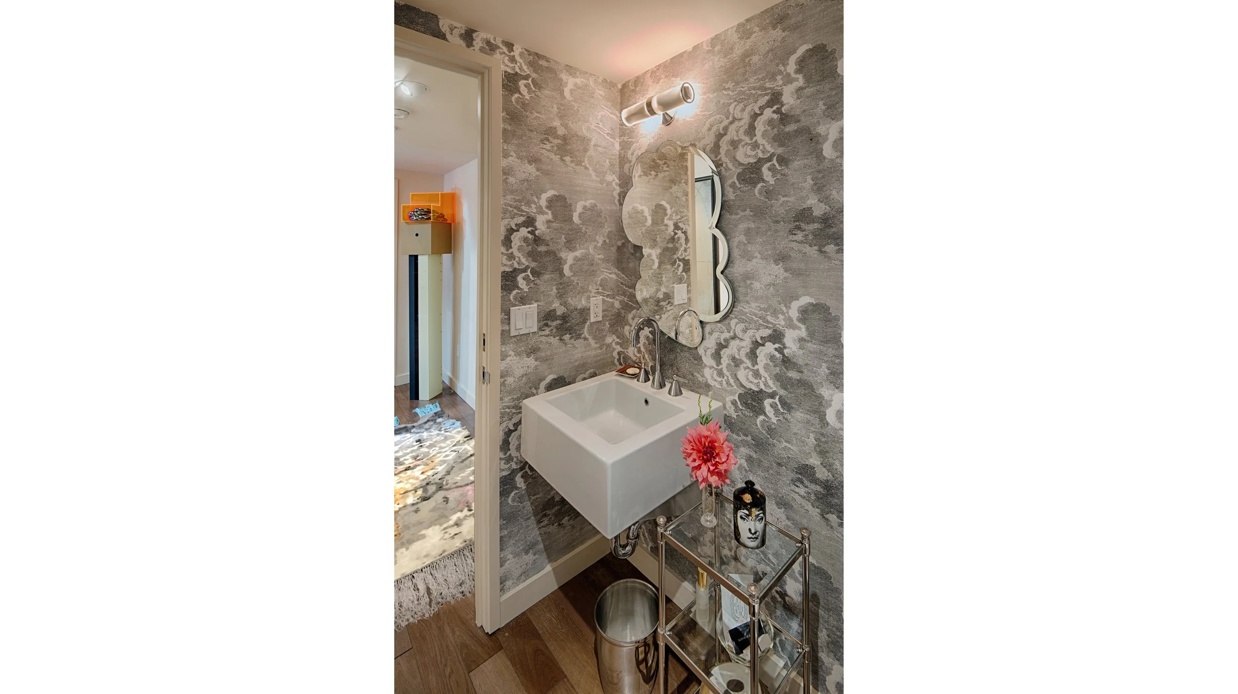 POWDER ROOM
Powder room with existing Fornasetti wall paper and custom-made “Thought Mirror.” 