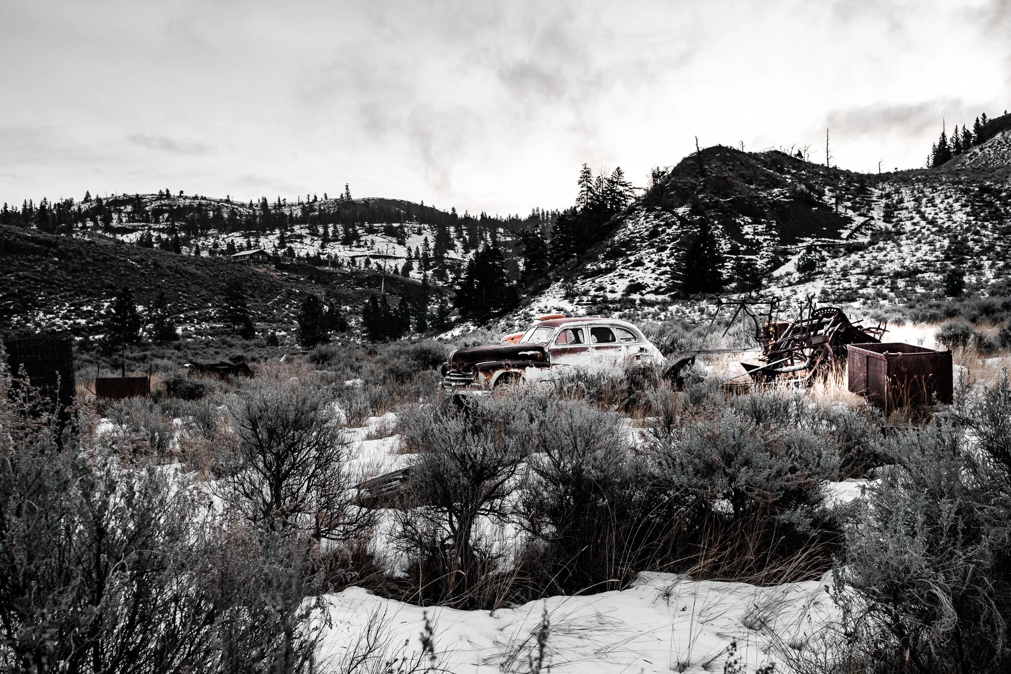 Abandoned vehicles in the Canadian wilderness in winter