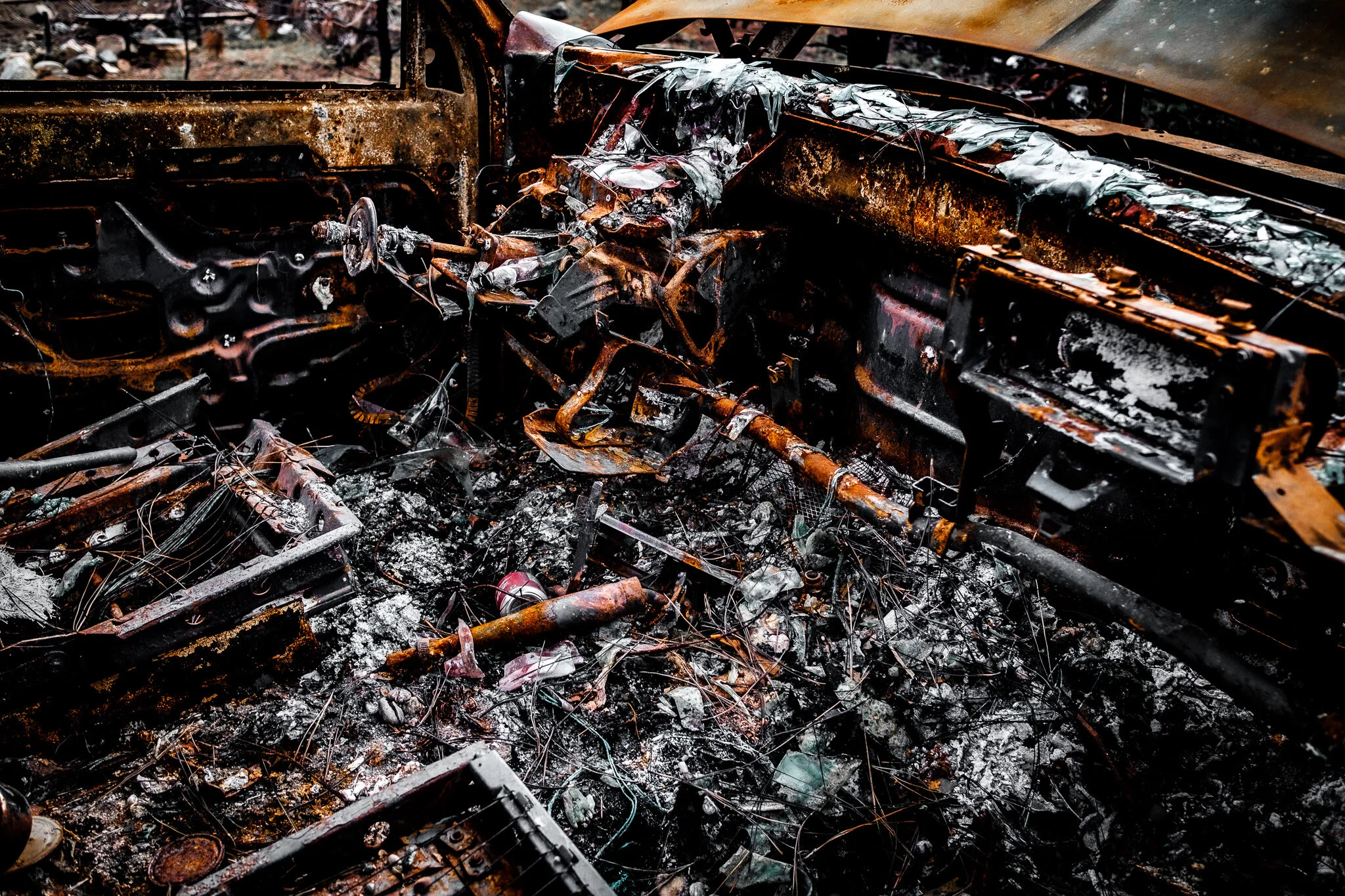 Abandoned and burned car interior in the Canadian wilderness