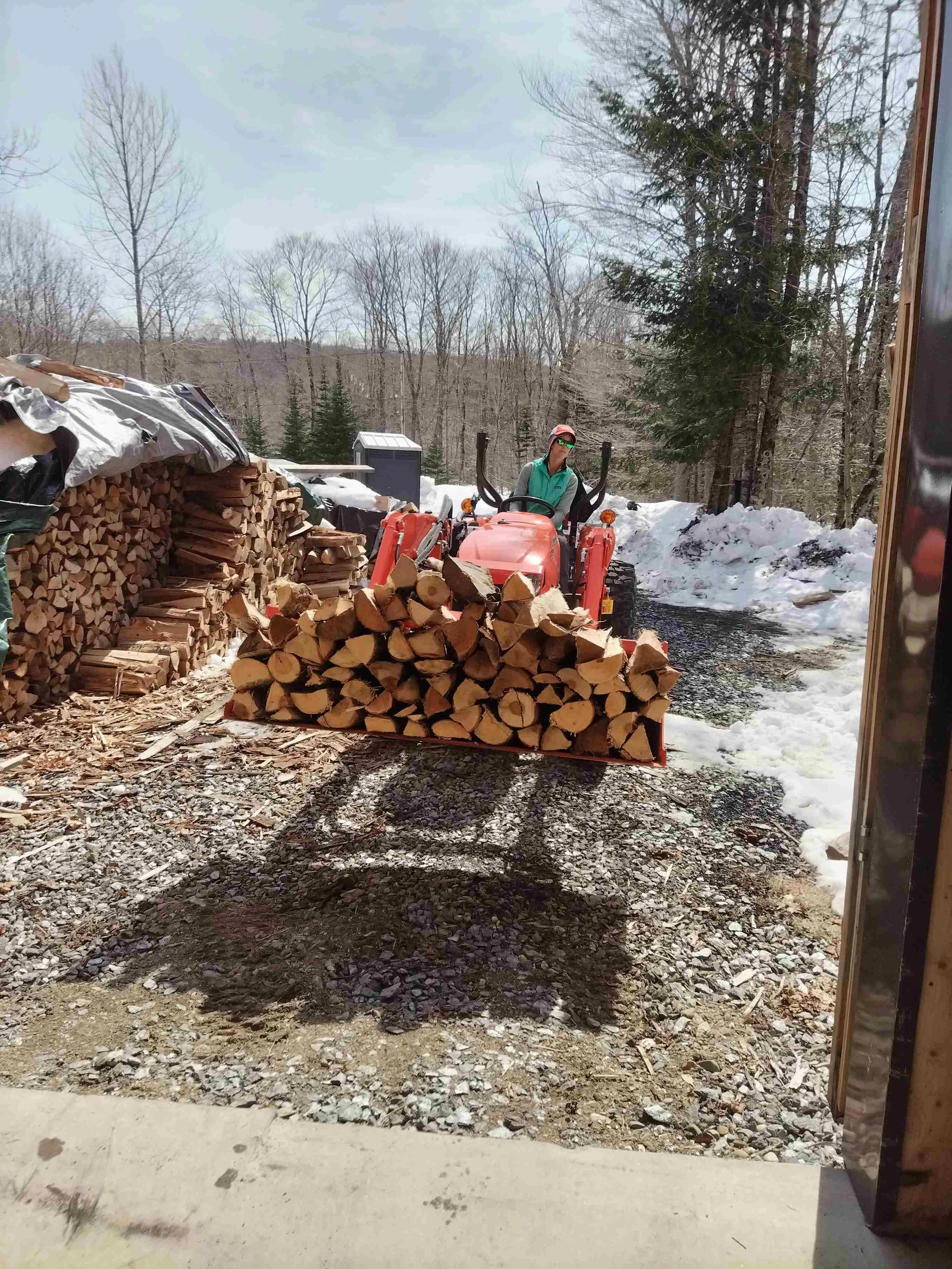 our Kubota and family bring more wood for our wood fired real maple syrup production.
