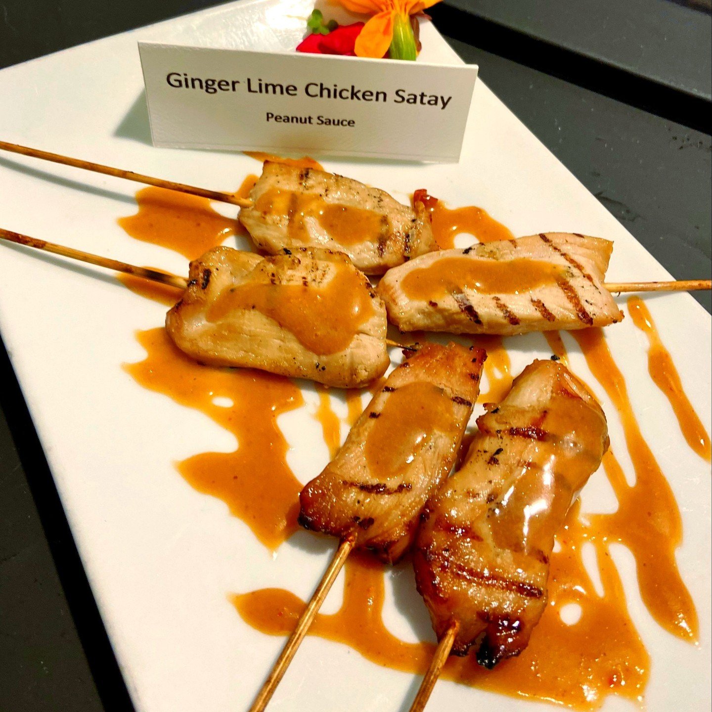 🎉 Ready to turn your event into an unforgettable feast? 🍽️ Check out our Ginger Lime Chicken Satay with a Creamy Peanut Sauce. From elegant tablescapes to mouthwatering delicacies, we've got it all covered.