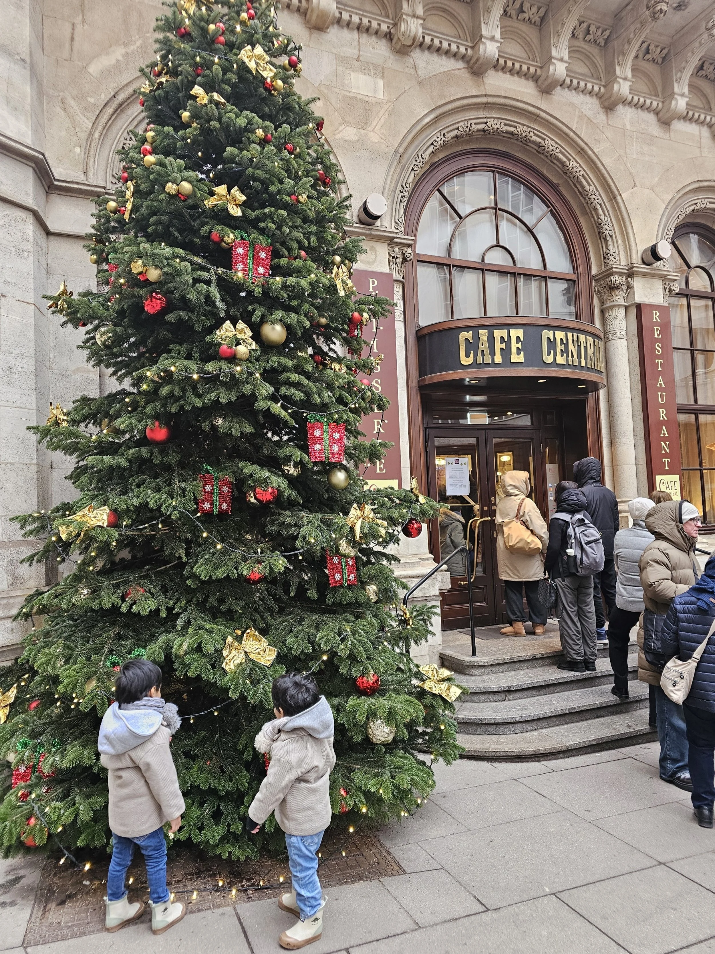 Toddlers outside cafe central