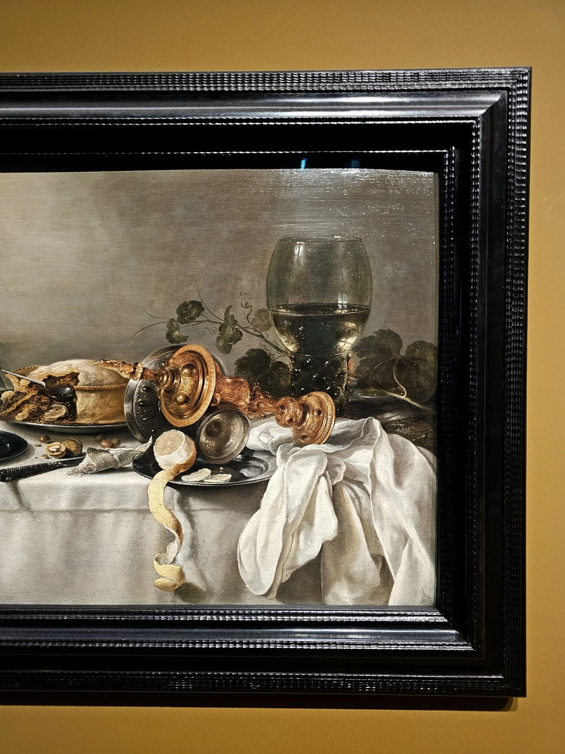 Still life with fruit pie, overturned silver tazza, gilt cup, and a 'Roemer' by Pieter Claesz