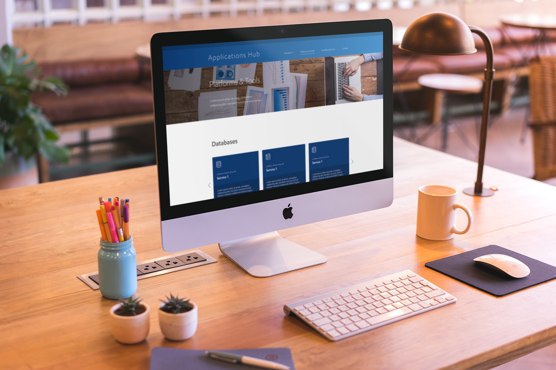 mockup-featuring-an-imac-set-up-on-a-beautiful-wooden-desk-a20415.png