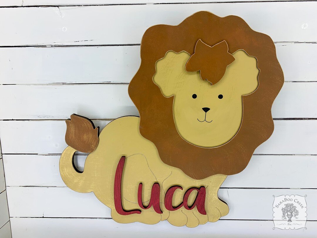 LIONS and tigers and bears oh my! Our lion accent piece as a 20&quot; custom cut nursery sign? Yes please! 🦁#lion #nurserydecor #nurseryideas #babynursery #safaridecor #safaritheme #safaribabyshower #safarinursery #baby #babyroom #customsign