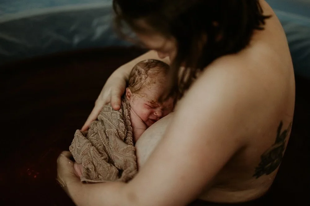 mother catching own baby in homebirth.jpeg