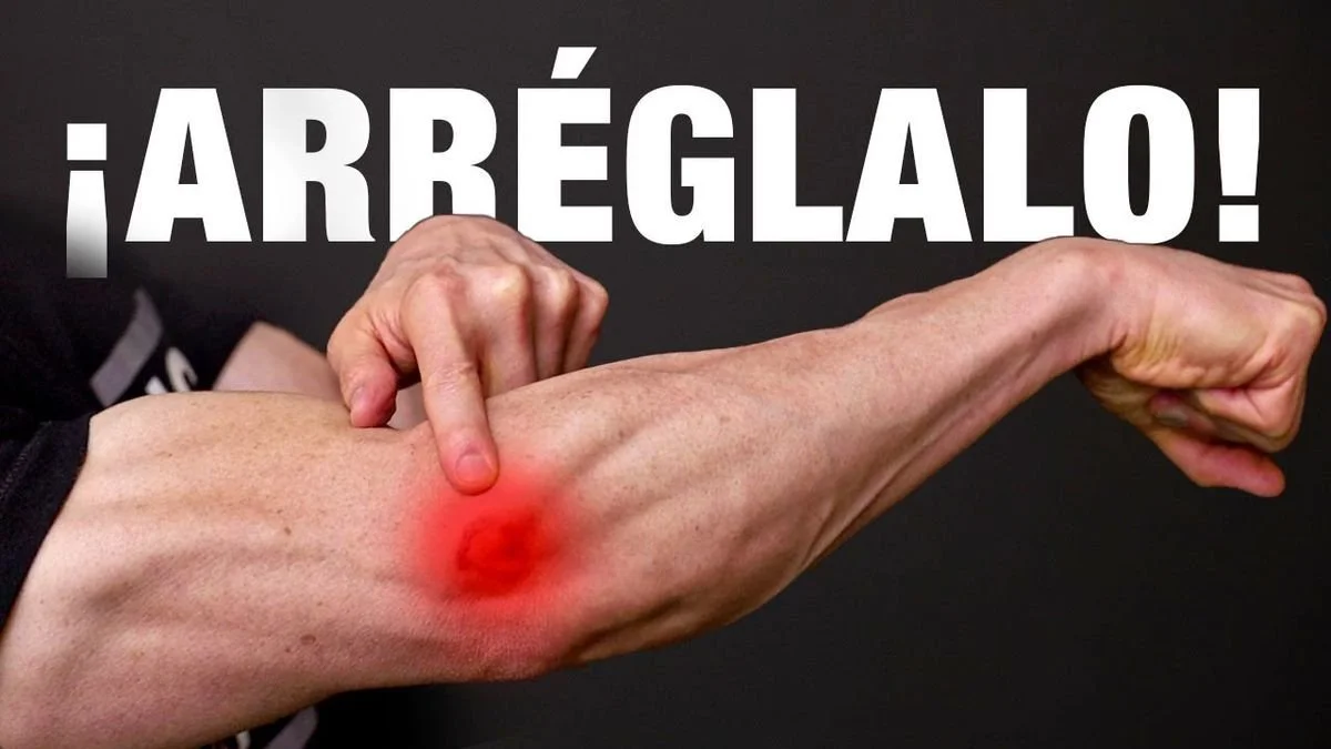 Una persona señalando una inflamación roja en su codo, con texto que dice '¡Arréglalo!'