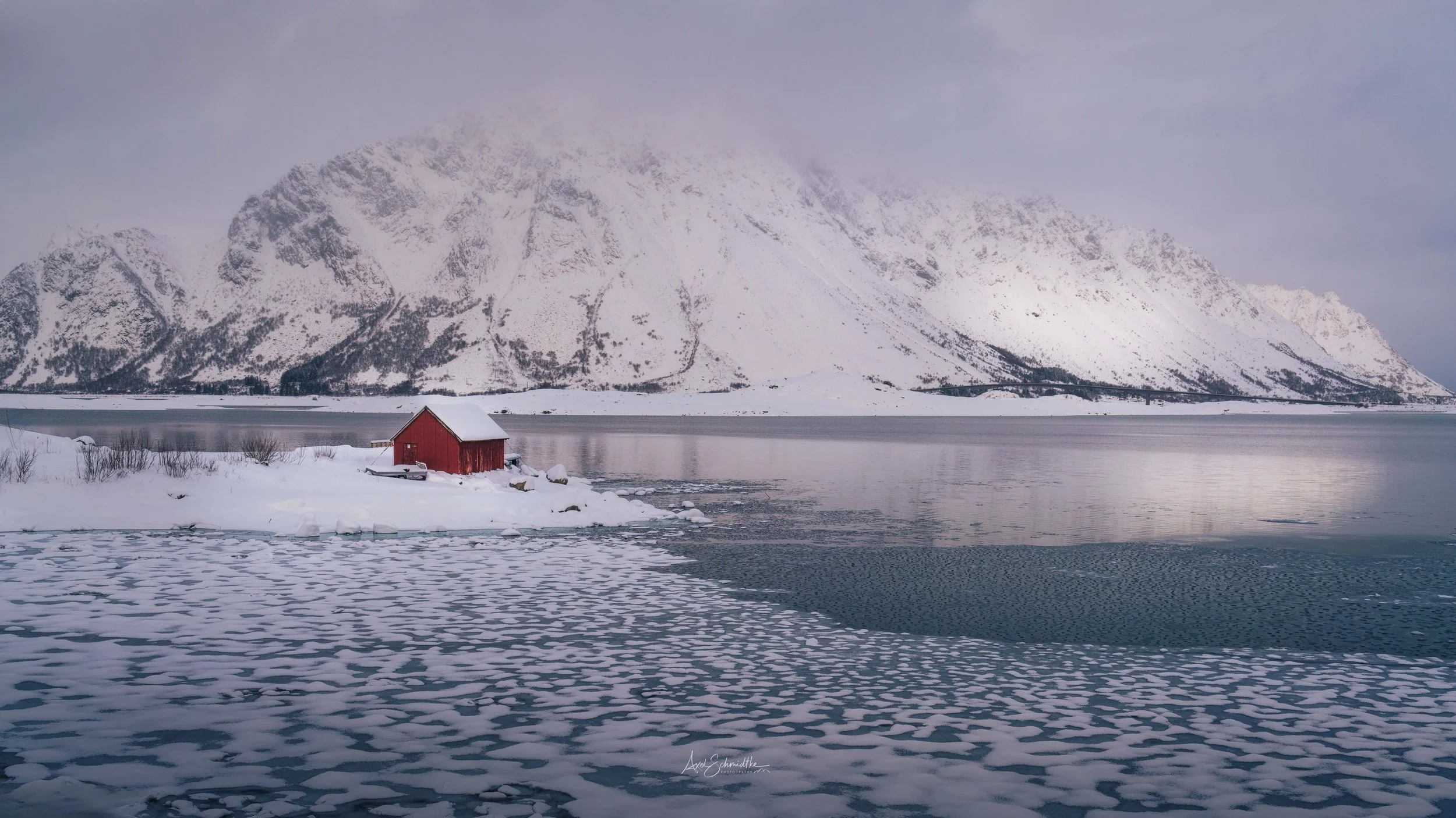 lonely-red-house-lofoten-mountain-snow-ice