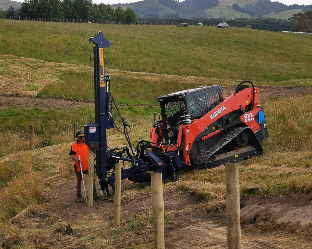 kubota skid steer with revolution post driver