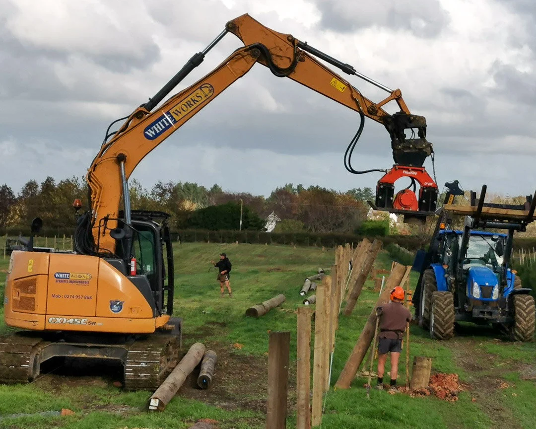 excavator with vibrator plate
