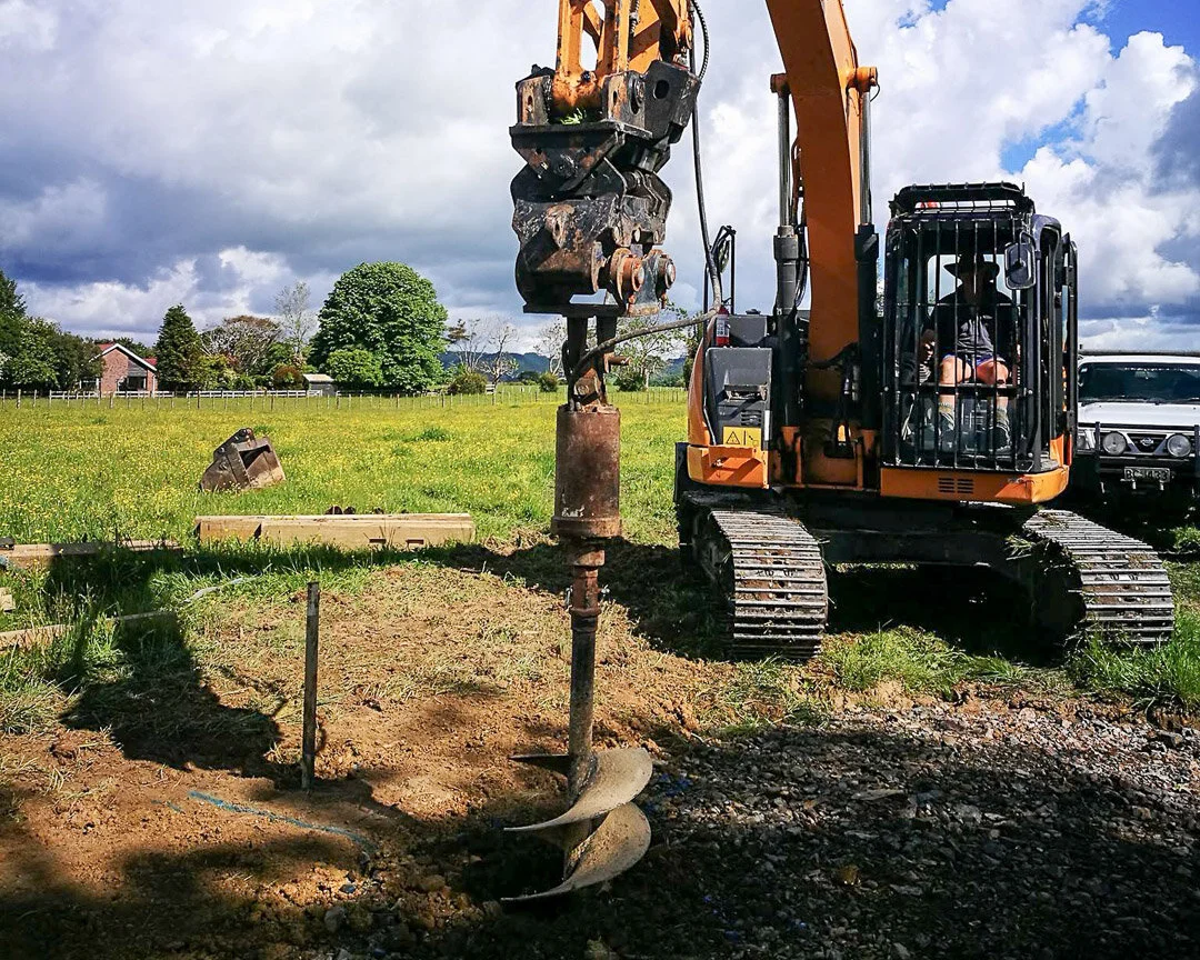 digger with auger drilling rig