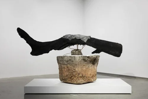 Sang Bung / Offering I, 2025, found object construction (concrete, steel, charred, wood, lead, bronze), 170x330x150 cm
